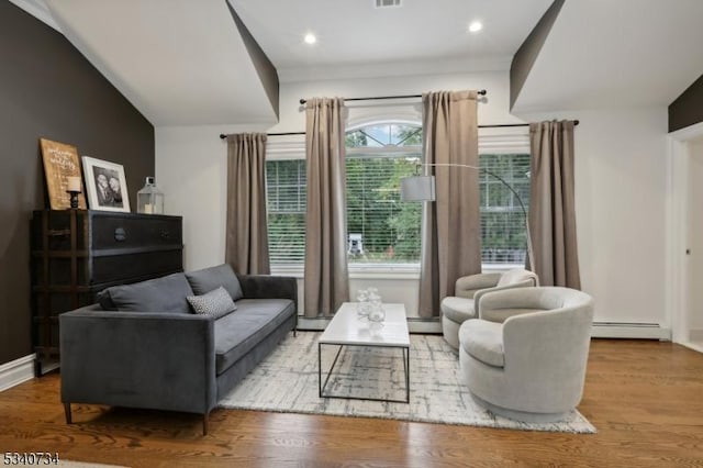 living room with a baseboard radiator, recessed lighting, a baseboard heating unit, wood finished floors, and baseboards