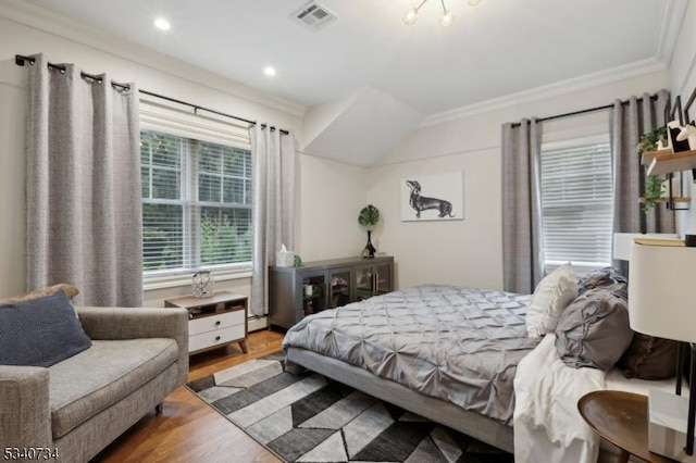 bedroom featuring recessed lighting, visible vents, wood finished floors, and ornamental molding