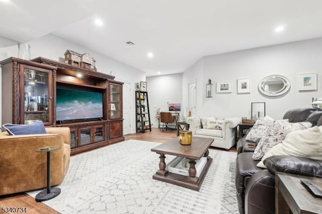 living area featuring wood finished floors, visible vents, and recessed lighting