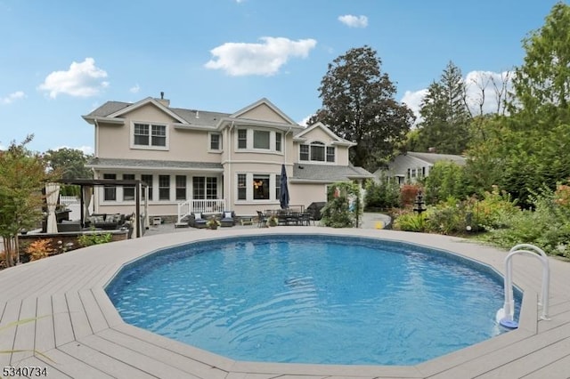 pool with a patio area