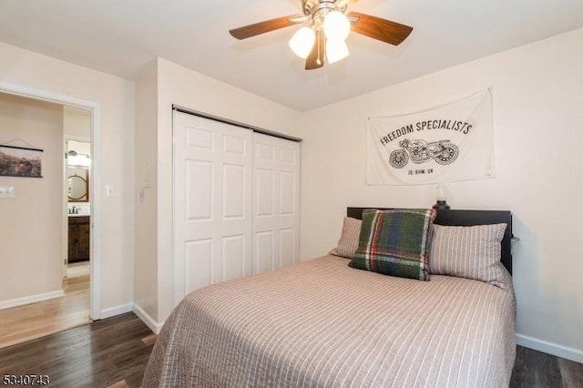 bedroom with ceiling fan, a closet, dark wood finished floors, and baseboards