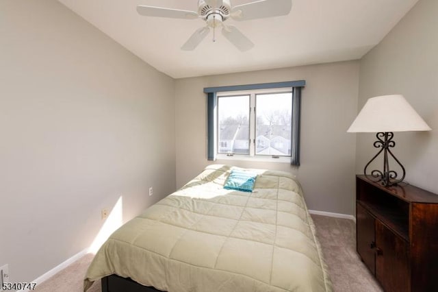 bedroom featuring carpet, a ceiling fan, and baseboards