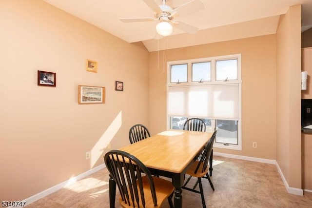 dining room with vaulted ceiling, ceiling fan, and baseboards