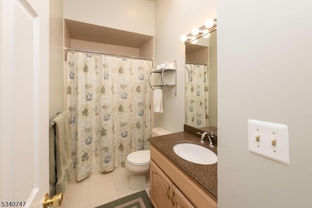 full bathroom with tile patterned flooring, curtained shower, vanity, and toilet