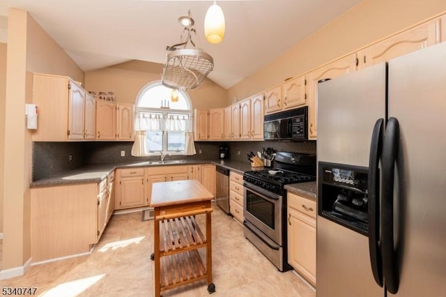 kitchen with lofted ceiling, stainless steel appliances, light brown cabinets, and decorative backsplash