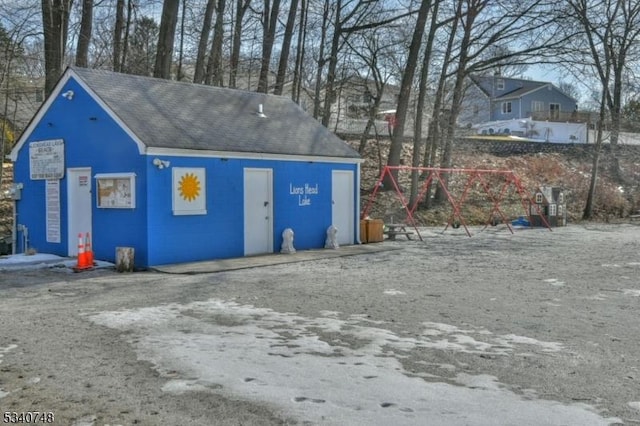 view of outdoor structure featuring a playground