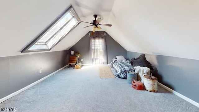 bedroom featuring a ceiling fan, carpet flooring, vaulted ceiling, and baseboards