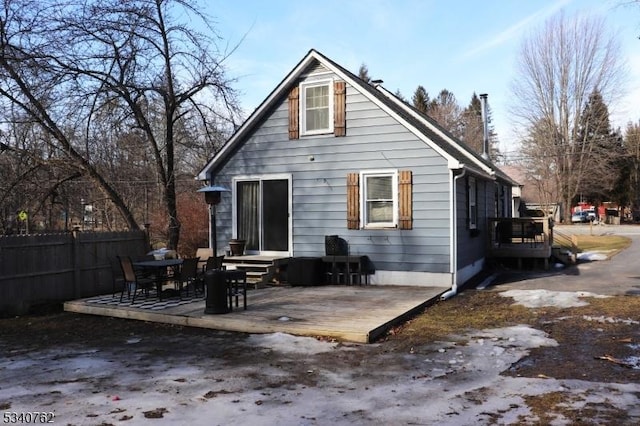 rear view of house with fence