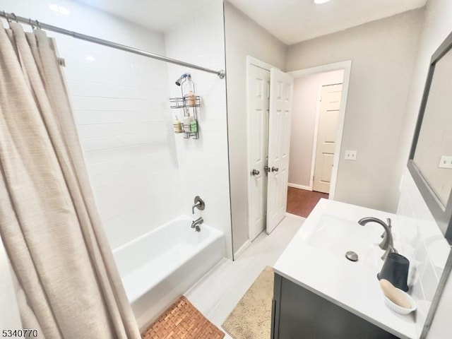 full bathroom featuring shower / bathtub combination with curtain and vanity