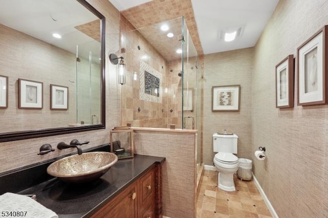 full bathroom with toilet, vanity, a shower stall, tile walls, and recessed lighting