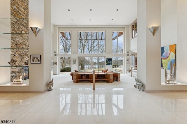 living area featuring a high ceiling