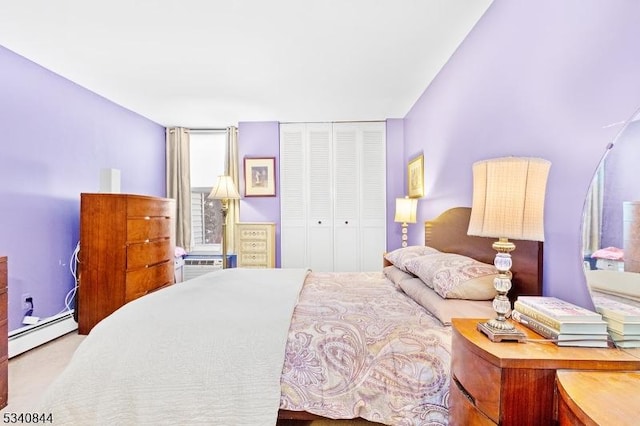 bedroom with a closet and a baseboard radiator