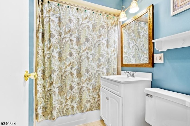 full bathroom with vanity, toilet, and shower / tub combo with curtain