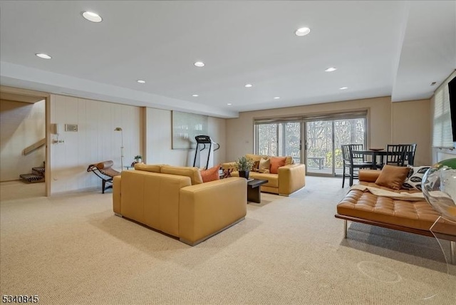 living room with recessed lighting and light carpet