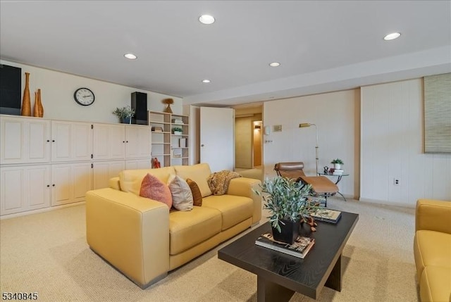 living area featuring recessed lighting and light colored carpet