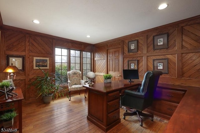 home office featuring light wood-style flooring, ornamental molding, and recessed lighting