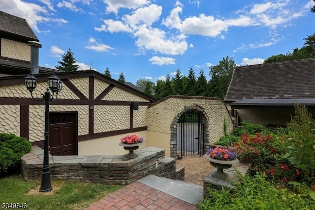 view of exterior entry featuring a gate