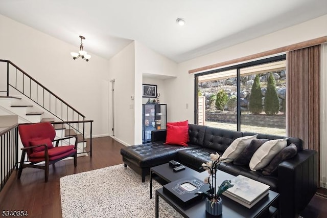 living room with dark wood-type flooring, baseboards, a chandelier, stairs, and lofted ceiling