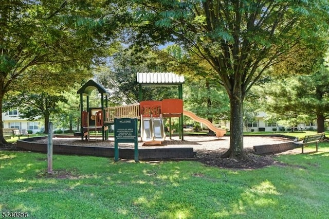 community jungle gym with a yard