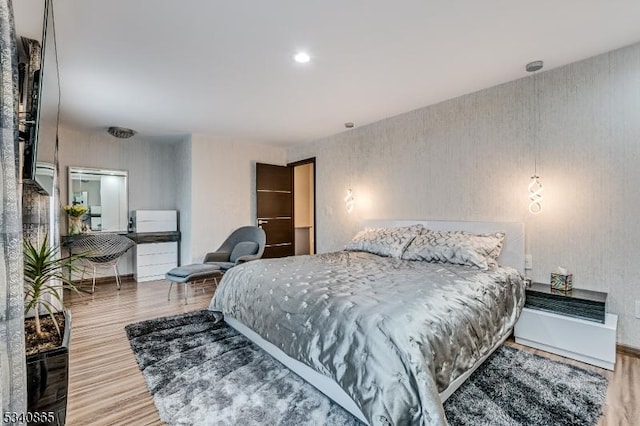 bedroom with wood finished floors