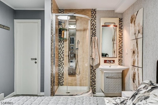 bathroom with ornamental molding, a shower stall, and vanity