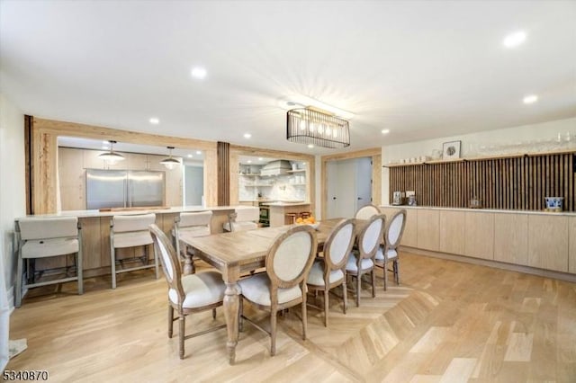 dining area with parquet flooring and recessed lighting