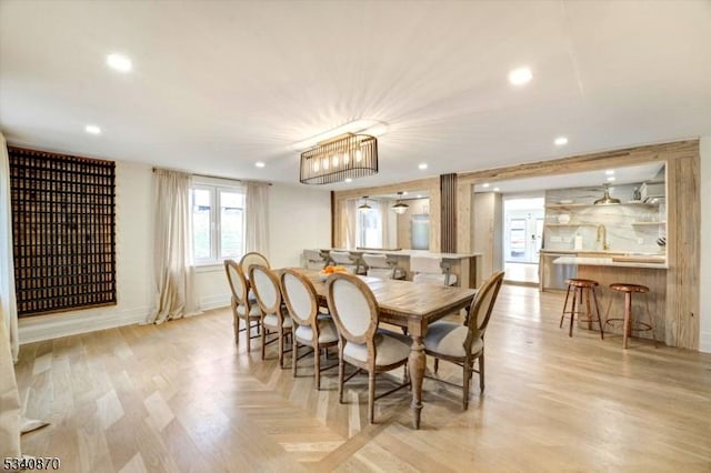 dining area featuring light wood-style floors and recessed lighting