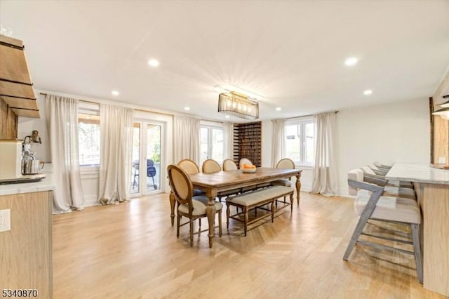 dining area featuring light wood-style flooring and recessed lighting