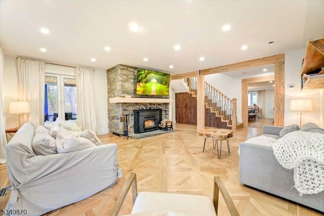 living room with stairs, a fireplace, and recessed lighting