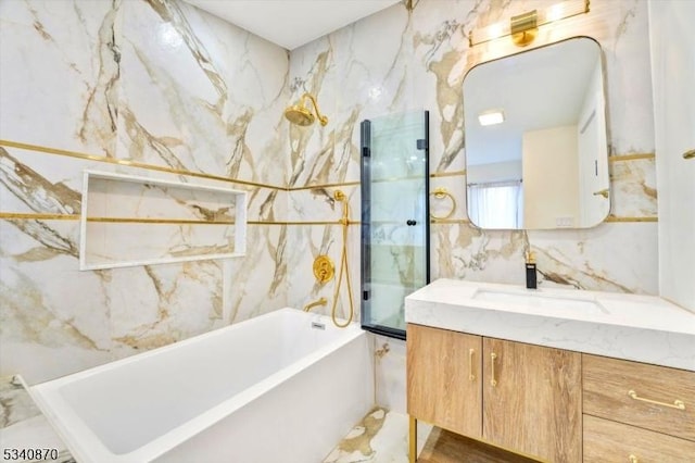 full bath with a washtub, a shower, tile walls, and vanity