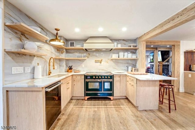 kitchen with range with two ovens, custom exhaust hood, and open shelves