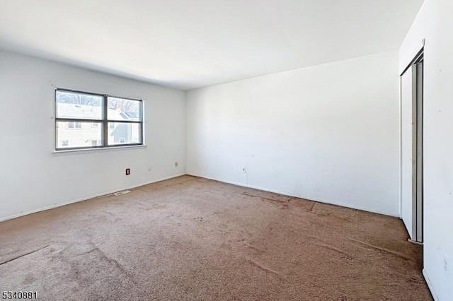 spare room with carpet