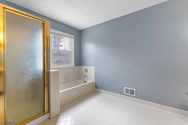 bathroom with a garden tub, visible vents, a stall shower, baseboards, and tile patterned floors