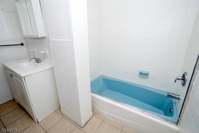 full bathroom with vanity, shower / bathing tub combination, tile walls, and tile patterned floors