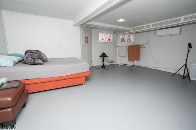 bedroom featuring concrete flooring and a wall unit AC