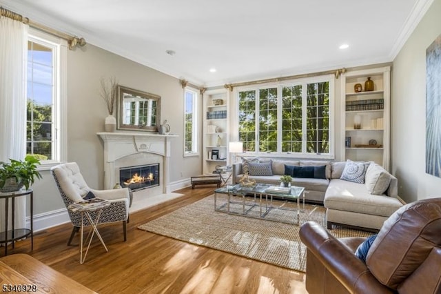 35 Geiger Ln, Warren Twp, NJ 07059 - living area featuring a fireplace with flush hearth, wood finished floors, crown molding, built in features, and baseboards