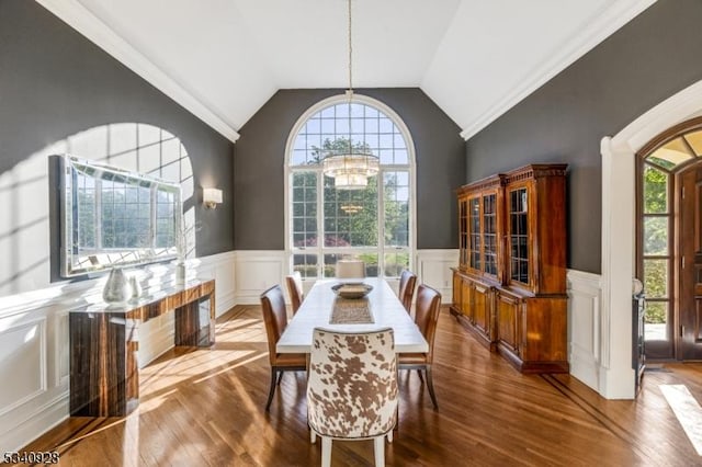 35 Geiger Ln, Warren Twp, NJ 07059 - dining space with a chandelier, wood finished floors, wainscoting, vaulted ceiling, and a decorative wall