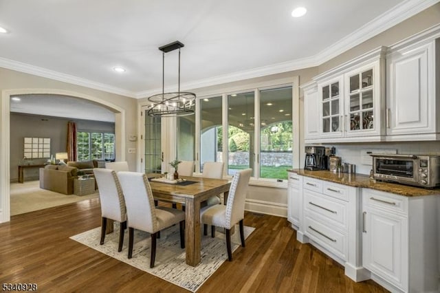 35 Geiger Ln, Warren Twp, NJ 07059 - dining area featuring a chandelier, crown molding, arched walkways, dark wood finished floors, and recessed lighting