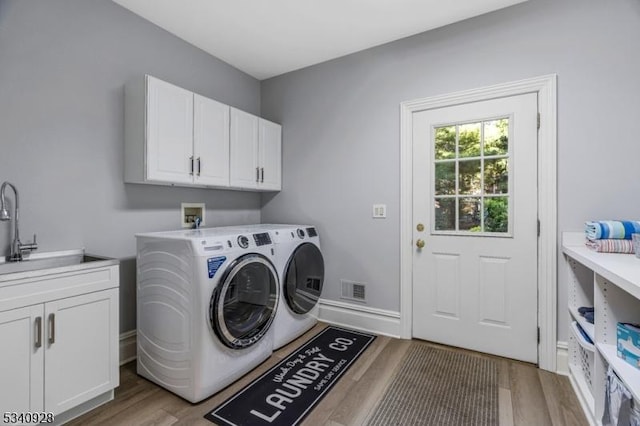 35 Geiger Ln, Warren Twp, NJ 07059 - washroom featuring cabinet space, washing machine and dryer, and wood finished floors