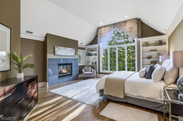 35 Geiger Ln, Warren Twp, NJ 07059 - bedroom with wood finished floors, a glass covered fireplace, high vaulted ceiling, recessed lighting, and baseboards