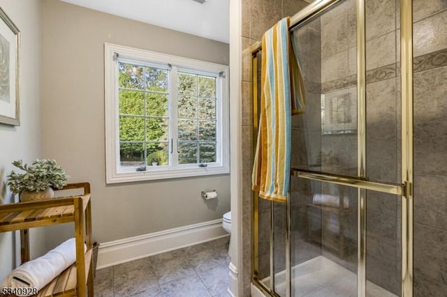 35 Geiger Ln, Warren Twp, NJ 07059 - bathroom featuring toilet, a shower stall, tile patterned flooring, and baseboards