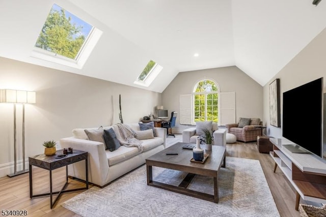 35 Geiger Ln, Warren Twp, NJ 07059 - living area with a skylight, vaulted ceiling, light wood-style flooring, and an office area