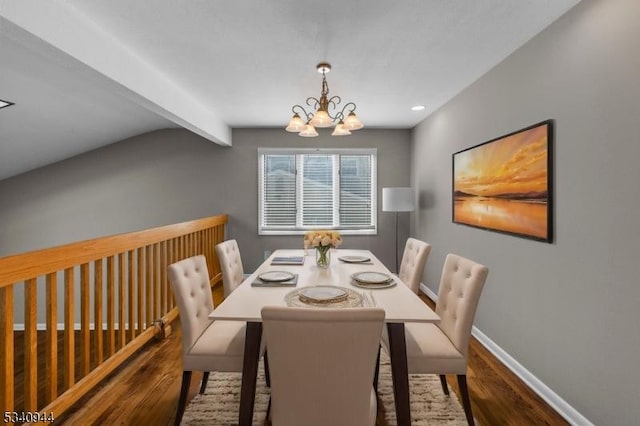 dining space featuring baseboards, beamed ceiling, wood finished floors, and an inviting chandelier