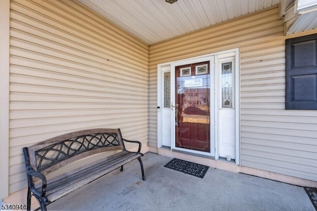 property entrance featuring a porch