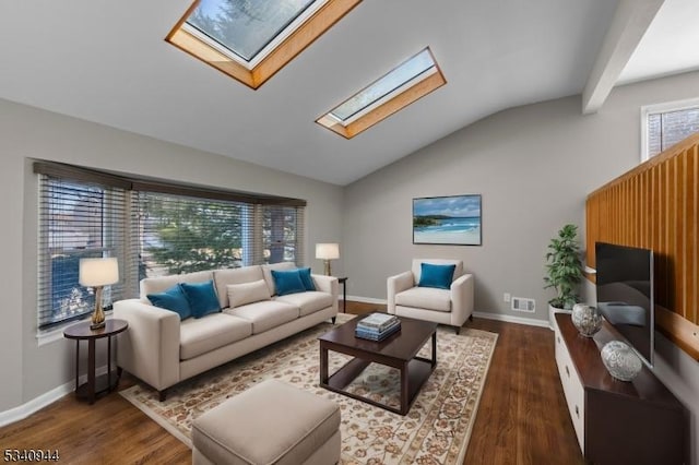 living room with vaulted ceiling with skylight, wood finished floors, visible vents, and baseboards