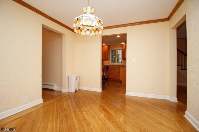 interior space featuring light wood finished floors, baseboards, a textured wall, ornamental molding, and baseboard heating