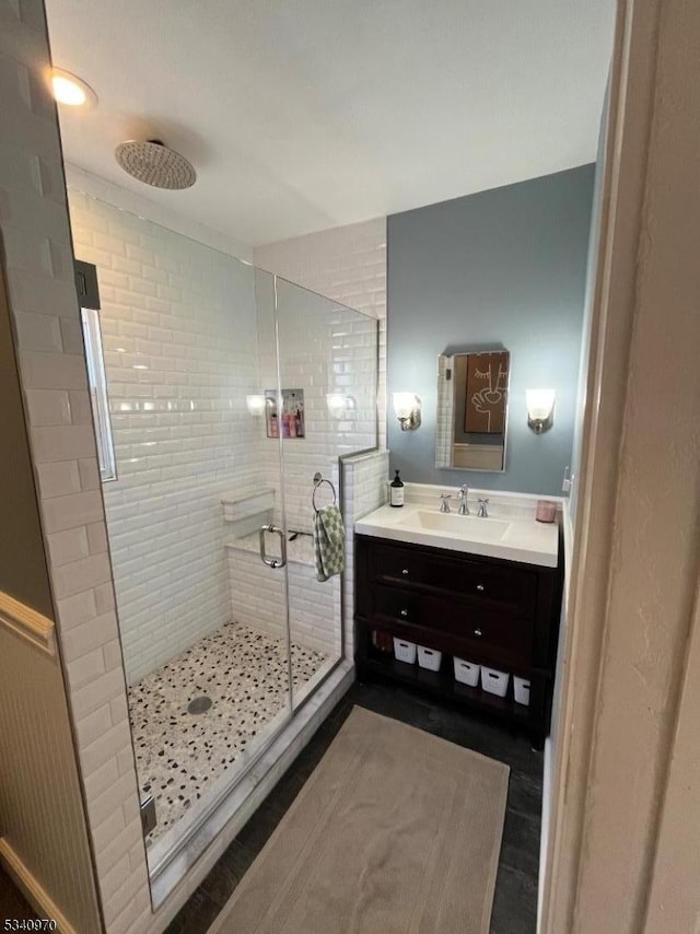 full bath featuring a shower stall and vanity