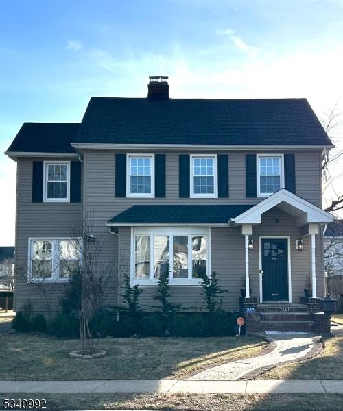 view of front of property featuring a chimney