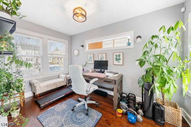 office space featuring wood finished floors and baseboards