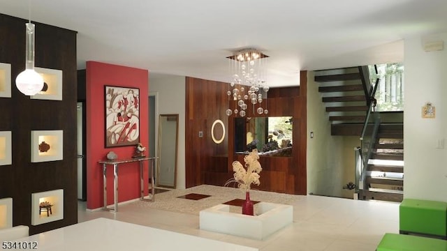 reception featuring an inviting chandelier and stairs